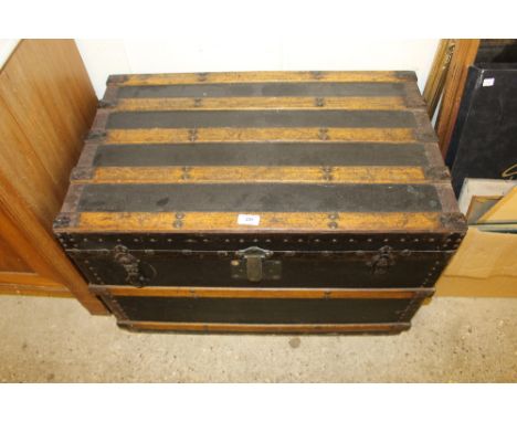 A wooden and metal bound trunk