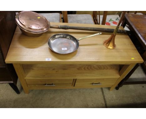 A light oak tv stand fitted two drawers