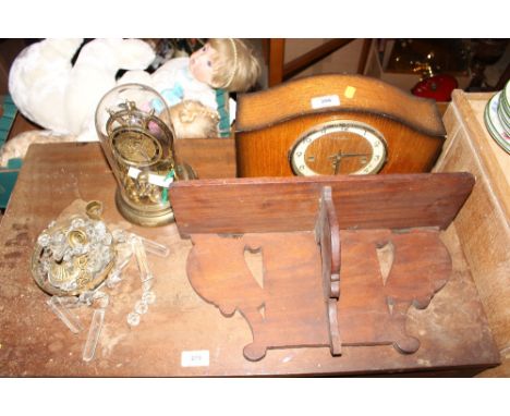 An oak cased three hole mantel clock; a wall bracket; and an anniversary clock etc. 