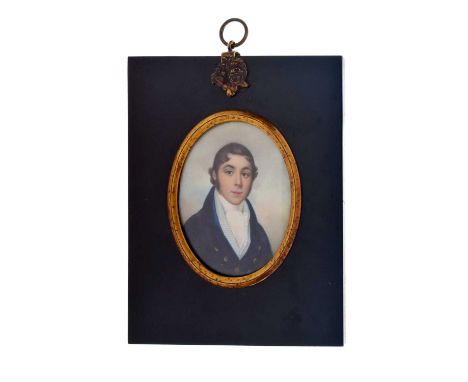 19th century portrait miniature of a gentleman wearing a navy blue high collared jacket and cravat, painted on ivory, inscrib