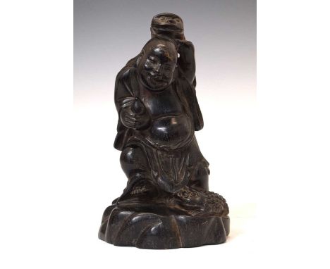 Chinese carved hardwood (zitan) figure of Liu Hai (Haichan), circa 1900, modelled with a three-legged toad on his back, anoth