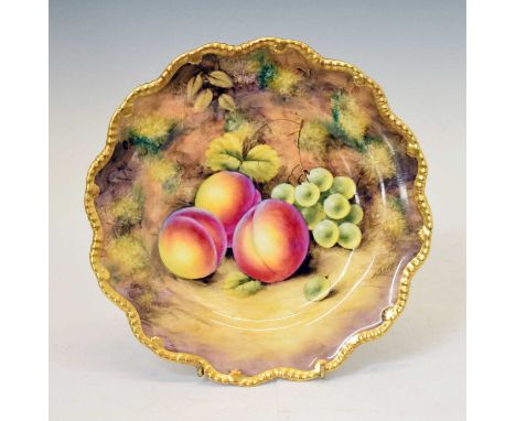 Royal Worcester porcelain fruit decorated plate, painted by J. Smith, within gilt gadrooned rim, black printed and painted ma