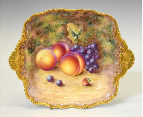 Royal Worcester porcelain fruit decorated twin handled square dish, painted by H. Ayrton, within gilt gadrooned rim, black pr