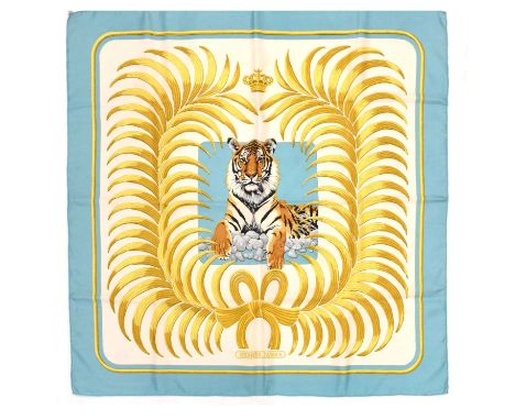 Hermès - Boxed silk scarf, having a light blue border with a recumbent tiger to centre, 88cm x 89.5cm