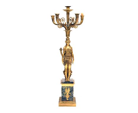 Gilt five-light figural candelabra, in the Empire taste, with four scroll branches centred by a further central candle nozzle