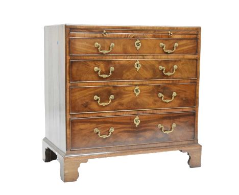Early 19th century figured mahogany and cross-banded chest, the rectangular top over brushing slide and four long cockbeaded 