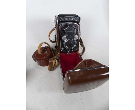 A Yashica-Mat compact camera, in fitted brown leather case