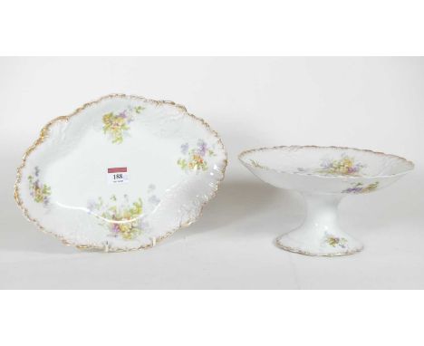 A Limoges porcelain comport, having a foliate rim within a gilt border and printed floral decoration, green underglaze mark t
