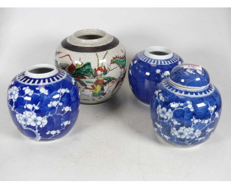 A Chinese porcelain ginger jar and cover, having a blue &amp; white prunus decoration, height 14cm, together with two further