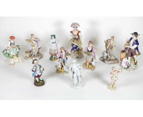 A collection of porcelain figures to include a pair of Sitzendorf figures of a lady and gentleman, each modelled seated with 