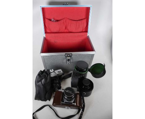 A Pentax Asahi SP1000 Camera, together with a Praktica camera, a Hoya 72mm zoom lens, further lenses and accessories in metal