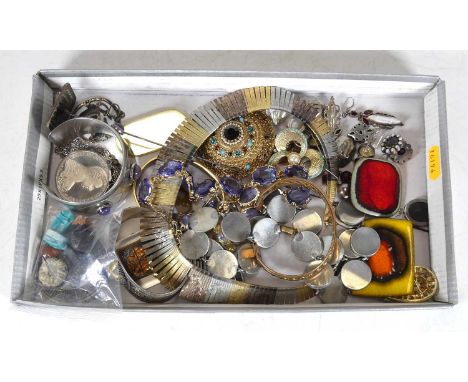 A collection of costume jewellery to include simulated amethyst and gilt metal choker, a gilt metal bangle, various ear clips