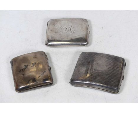 A George V silver cigarette case, of curved rectangular form, having a circular cartouche with engraved monogram and further 
