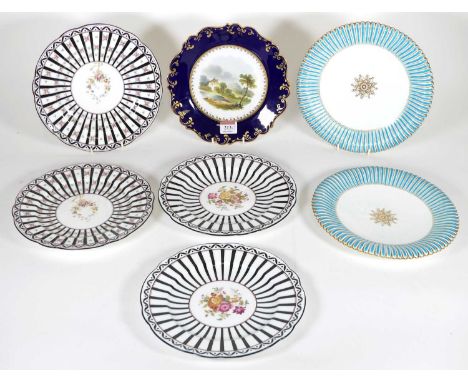A pair of 19th century Ridgway porcelain plates, having lobed fluted border with gilt decoration to the centre, puce crest ma