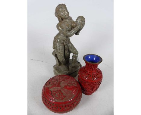 An Indian carved hardstone figure of a dancing Shiva, height 20cm, together with a Chinese carved cinnabar baluster vase and 