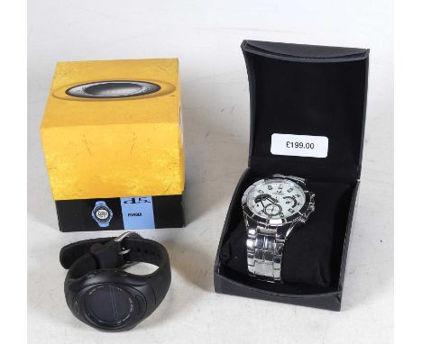 An Oakley gentleman's quartz sports watch, having a digital display on integral rubber strap with original box and instructio