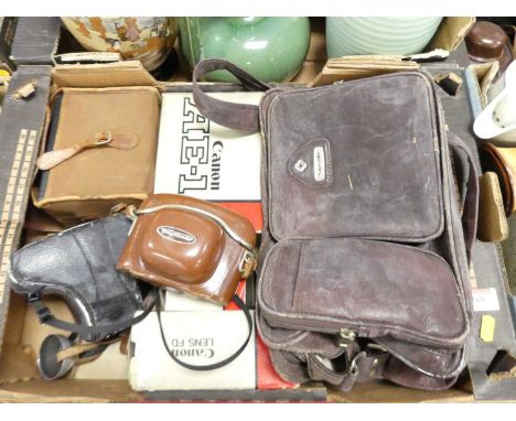 A Canon AE-1 compact camera in fitted case, together with various other cameras and related lenses and equipment 