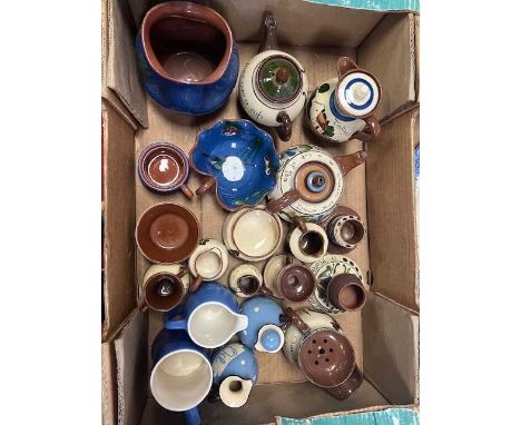 A collection of Devon mottoware to include teapots, match strikers, jugs and egg cups.Treaddur Bay mug – chip to base, no cra