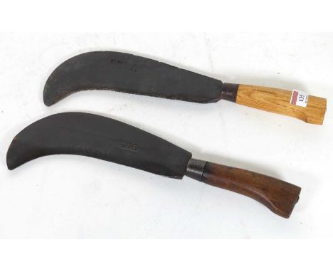 A military bill hook, the blade bearing broad arrow mark and stamped Elwel 1942, length 40cm; together with another
