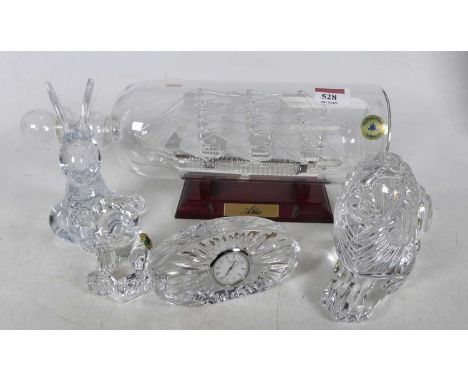 A Waterford crystal teddy bear, modelled seated, height 7cm, together with a Waterford crystal  bedside clock, a crystal mode