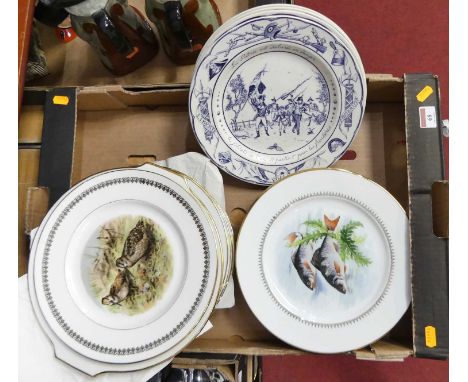 A collection of tablewares to include a set of twelve German porcelain plates, each decorated with fish within a gilt border,