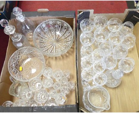 A collection of glassware to include cut glass brandy balloons, decanters and table bowls