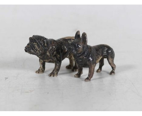 A cast silver model of a British bull dog, London, 1990, length 4cm, together with another of a French bull dog, gross weight