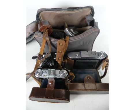 A Ricoh 500G, Voigtlander VITO II &amp; Bessa I camera in fitted case, together with various other lenses, and related equipm