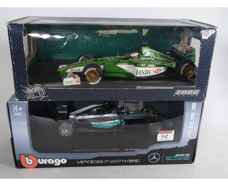 A Burago 1/18 scale Mercedes F1W07 Hybrid scale model car, boxed, together with a Hotwheels Racing 1/18 scale Jaguar Formula 