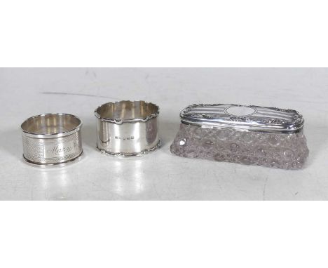 Two silver napkin rings, together with a cut glass dressing table box, having a silver lid, weighable silver 1.6ozt (3)