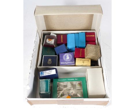 A collection of thimbles to include silver and porcelain examples by Royal Worcester, Crown Staffordshire and Wedgwood