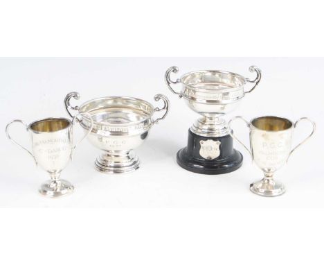 A small George V silver trophy cup of circular form with twin double scroll handles, the body engraved "West Briton" Bowl, P.