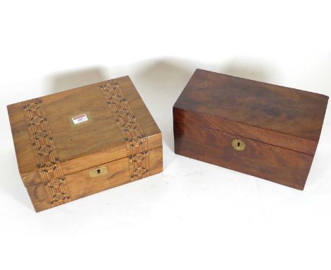 An early 20th century mahogany tea caddy of plain rectangular form, the hinged lid opening to reveal a fitted interior, toget