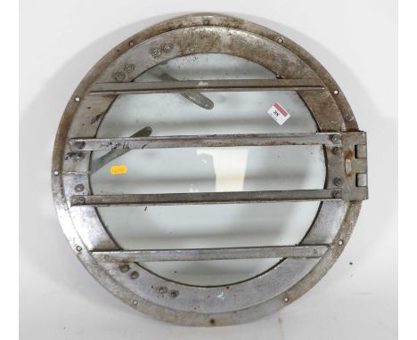 A galvanised iron ship's porthole of typical circular shape, dia. 50cm