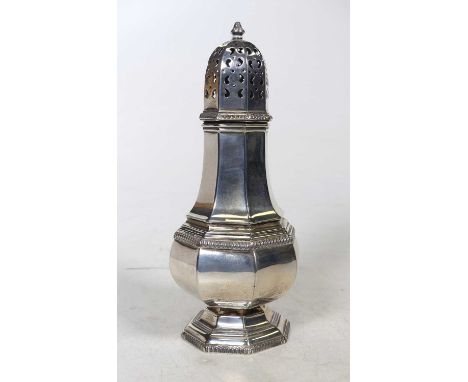 A George V silver sugar caster, of octagonal baluster form, the pierced domed cover with circular finial, on stepped foot, Al