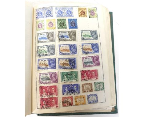 A stamp album and contents to include Victorian penny reds, further British stamps, and world examples from Hong Kong, India,