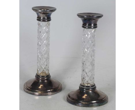A pair of Elizabeth II silver mounted table candlesticks, each having a hobnail cut glass column, on a weighted circular foot