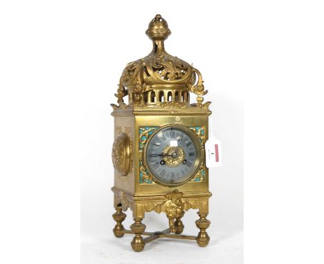 A late 19th century brass mantel clock of architectural form, the metal dial with Roman numeral markers, having an eight day 
