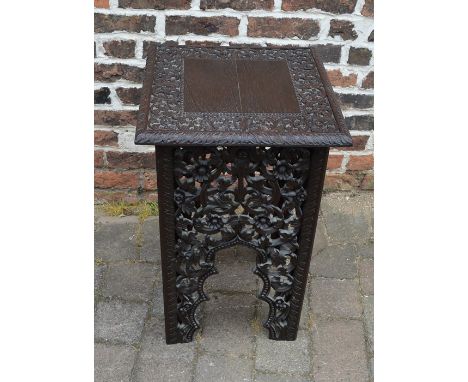 Ornately carved lamp table with pierced fretwork side panels