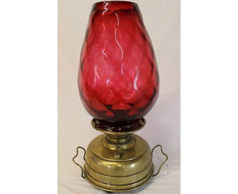 Brass paraffin lamp with large cranberry glass shade (damage to rim)