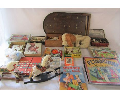 Selection of vintage toys including wooden jigsaws and bagatelle board