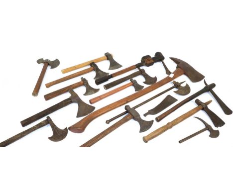A Congo Axe, with narrow blade inserted into the mask carved wood haft; an Indian Steel Axe, with crescent shape blade and tu