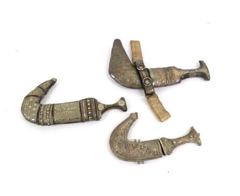 Two Arab Jambiyas, each with double edge curved steel blade with raised medial ridge, horn grip with white metal mounts and s