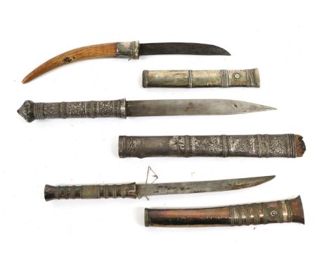 A 19th Century Burmese Dha Knife, with 12.5cm single edge slightly curved steel blade, curved ivory spike grip and silver sca