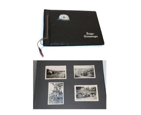 A German Third Reich 'Grossdeutschland' Photograph Album, the black embossed leather look binding applied with a small Army s