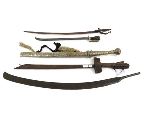 A Late 19th Century Indonesian Sword, the 50cm single edge steel blade with narrow fuller to the back edge and upturned tip, 