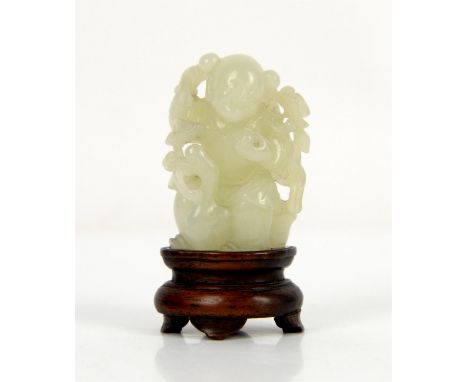 A small Chinese green jade figure of a boy  standing beside a duck; about 5 cm high; with a wood stand [2]Provenance: The Pro