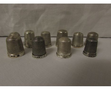 TEN SILVER THIMBLES - each with British assay marks for Birmingham, Chester and Sheffield, of plain form and dimpled all over