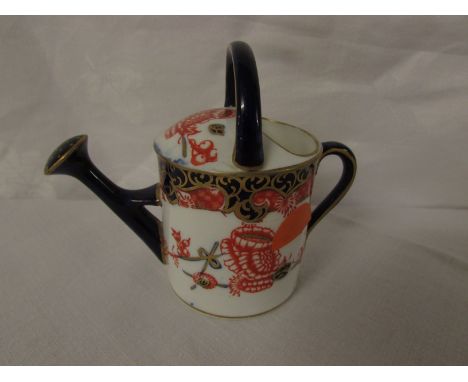 Royal Crown Derby porcelain model of a watering can in the Imari palette, height 7.5cm, red factory transfer mark, year stamp