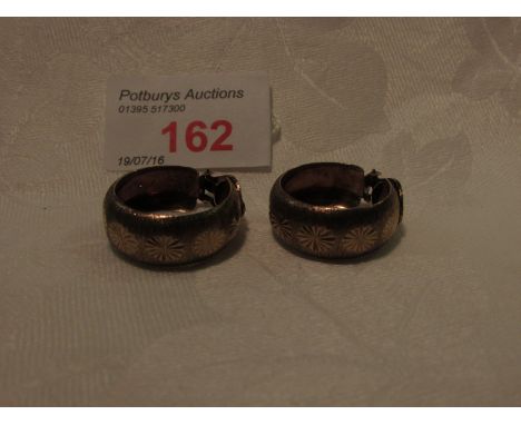 Pair of 9ct gold hoop earrings, engine-turned finish and etched with florets, 3.8g